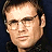 A 48x48 pixel buddy icon split into two sections: a grayscale portrait of a man on the left and green text reading "Original Icons .com" on a dark green background on the right.