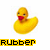 Yellow rubber duck with red beak, pixelated image showing two states: left side has 'RUBBER' text below, right side shows 'DUCK' text.