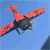 A red biplane flies against a blue sky with mountains, dropping a white banner that reads "I LOVE YOU" with a red heart symbol.