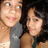 Two people pose together in a pixelated image with visible animation changes across frames.