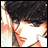 Pixelated anime-style character with dark hair and orange skin tones, side profile against black background with white text.