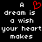 A black background displays white pixelated text reading 'A dream is a wish your heart makes' with a red pixelated heart symbol replacing the letter O in 'dream'.