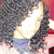 Pixelated static image of a figure in dark clothing with light-colored hair, wearing blue shorts against a gradient background.