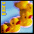 Yellow duckling with red beak and black eyes floats on light blue background with vertical text reading QUACK.