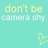 A static image with a light teal background displays repeated text and heart symbols in yellow-green.