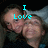 Two people in a close-up pose with cyan text overlay reading 'I Love' on the left and 'U girls' on the right, pixelated style.