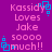 Purple background with pink text reading 'Kassidy Loves Jake soooo much!!' and blue square-shaped pixel art elements scattered around.