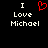 Two side-by-side pixelated text displays on black background, each reading "I Love Michael" with a red heart symbol replacing the word 'love' in left display.