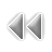 Pixelated gray icon with two left-pointing triangular shapes connected by a central vertical bar on a solid gray background.