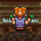 Pixelated character with orange hair in twin buns, purple shirt, and red shoes stands against a brown brick wall background.