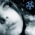 A grayscale anime-style face with a small mole on the cheek, accompanied by a blue star-shaped icon with a white outline.