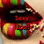 Pixelated close-up of a mouth with red lips, showing teeth and tongue, with red text reading 'Sexy' and 'Joss!!' overlaid on the image.