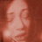 Pixelated static image of a person's face with reddish-brown color palette and low-resolution rendering, appearing as an AOL Instant Messenger buddy icon.