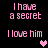 Pixelated pink text on black background with animated heart symbols appearing and changing color.