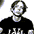 Pixelated black-and-white image of four people in a with text 'good charlotte' below