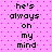 Pixelated text on a pink background with purple dots, repeating 'he's always on my mind' in two