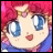 Pixelated anime-style character with large blue eyes, pink hair, and a smiling expression, next to stylized text on a black background.