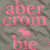 Pixelated text and a small animal icon on a gray background with pink overlay elements.