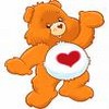 Orange cartoon bear with brown nose and eyes, standing with one arm raised, wearing white belly patch with red heart symbol.