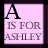 Pixelated graphic with large black 'A' at top, gray text below reading 'IS FOR ASHLEY', pink background bordered by dark purple frame.