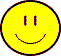 Two yellow circular faces with black outlines and red accents, one pair of vertical eyes above a curved smile, another with wide white eyes and an open mouth showing red tongue.