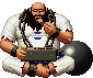 Pixel art character in white robe with blue emblem, chained hands holding small device, seated cross-legged on gray background.