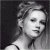 Black-and-white pixelated portrait of a woman with styled hair, next to green text reading 'Original Icons .com' on dark background.