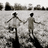 Two pixelated figures holding hands on a beach with trees in the background, text reading 'ii lovee derekk' on the right.