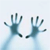 Two pixelated hands with dark blue palms and fingers extend from the bottom against a light blue gradient background.