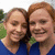 Two people in blue shirts stand side-by-side with green foliage behind them, text overlays change across frames.