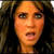 A pixelated image of a woman with long brown hair, showing three sequential facial expressions in a
