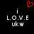 A black background displays two identical pixelated text arrangements with a red heart symbol above them, each containing 'i', 'L.O.V.E', and 'ukw' in white pixels.