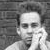 Black-and-white image of a person with hand near face, repeated in with text above and below