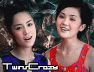 Two women in red and blue sleeveless tops stand side-by-side against a dark patterned background with text "TwinCraz" at the bottom.