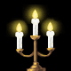 Animated candelabra with three lit white candles on a golden base, showing subtle flame flicker against black background.