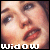 A pixelated close-up of a person's face showing eyes, nose, lips, and forehead with the word 'Widow' in white block letters at the bottom.