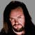 Static pixelated image of a person with long dark hair against gray background, likely a music artist avatar.