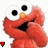 Red puppet character with large white eyes and black pupils, orange nose, open mouth showing dark interior, hands near face in two of each