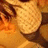 Pixelated image with a dark red background, featuring pink text and an orange-toned figure on the left.