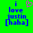 Green background with blue pixelated text reading 'i love justin [haha]' and a pink heart symbol above the first 'i'.