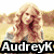 Four distinct images arranged in a , each with 'AudreyK' text overlay, featuring a woman, cat, dog, and cartoon characters