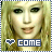 Pixelated image of a person with long blonde hair and green eyes, featuring two text labels below the face.