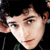 Static 50x50 pixel buddy icon showing a close-up of a person's face with dark hair and light skin, cropped to show eyes, nose, mouth, and part of the forehead against a black background.