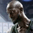 A bald man in a green sleeveless shirt appears in two states: one with no text overlay and another with "KG" text over his face.