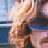 Pixelated static image of a person in motion with blurred background elements, likely from a film scene.