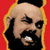 Bald man with black beard and mustache, wearing yellow outline on red background, showing teeth in three variations of facial expression.
