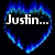 Blue heart-shaped flame icon with 'Justin...' text above red broken heart and 'TO MY HEART' text below, next to key on pink fabric.