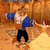 Pixelated figure in blue top and black pants against warm orange-brown background with visible pixelation artifacts.