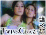Animated sequence of two women in colorful outfits performing under stage lights with 'TwinsCrazy' text overlay.
