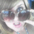 Pixelated anime-style character with light hair and pink cheeks, wearing dark sunglasses; blue text reads 'bitch iim famous' on the right side.